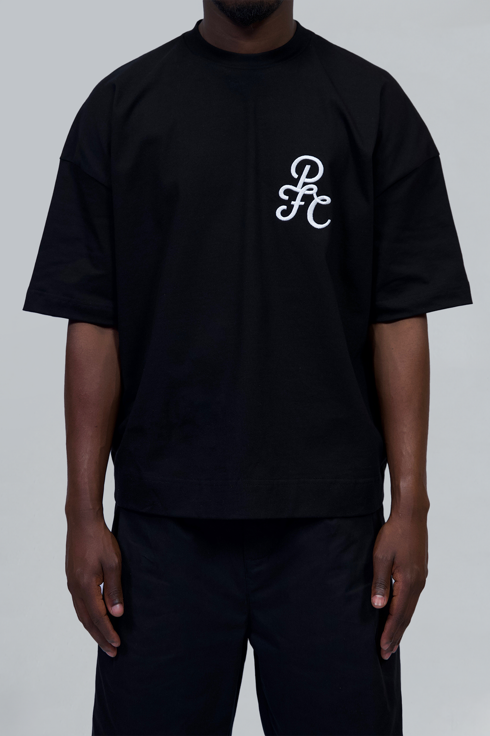 Black 'Emblem' Tshirt