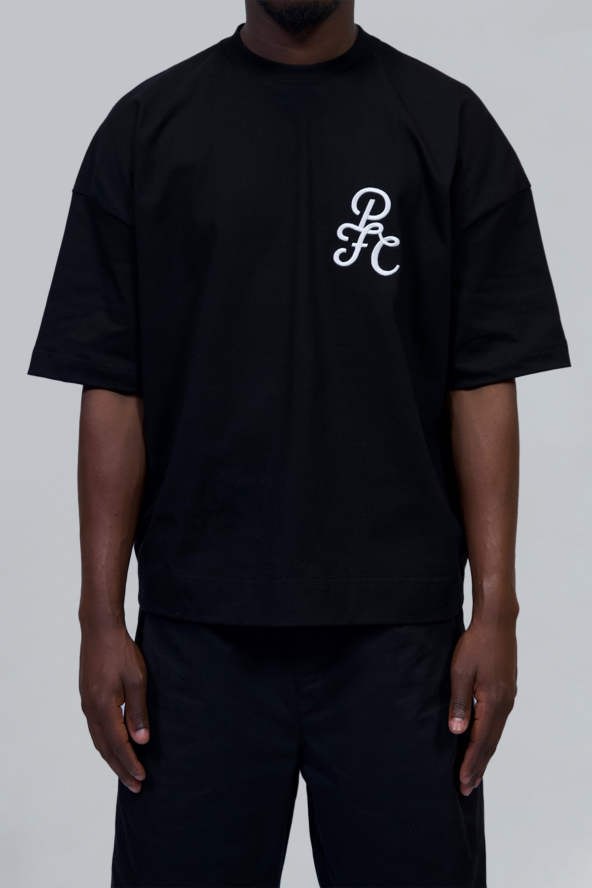 Black 'Emblem' Tshirt